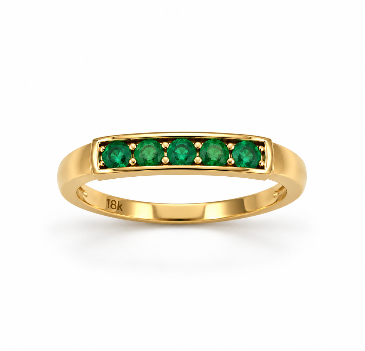 Anillo de oro de 18 kilates con cinco esmeraldas redondas